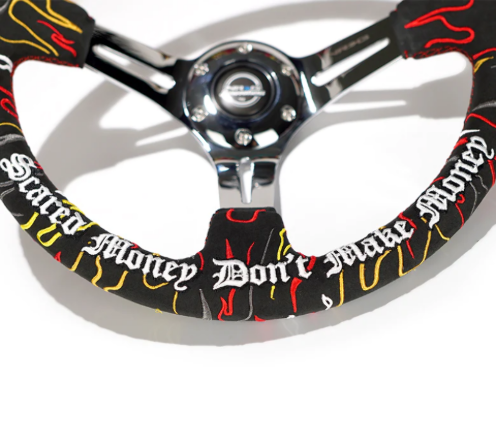 Reinforced Steering Wheel - Ryan Litteral Signature 3" Deep, 5 mm chrome spoke with slit spokes. Black Alcantara, Red Stitching, Flame Embroidery"Scare Money Don't Make Money" Finish.